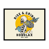 Framed poster with skeleton holding lacrosse equipment and 'Rise & Grind Hobolax' text on a beige background
